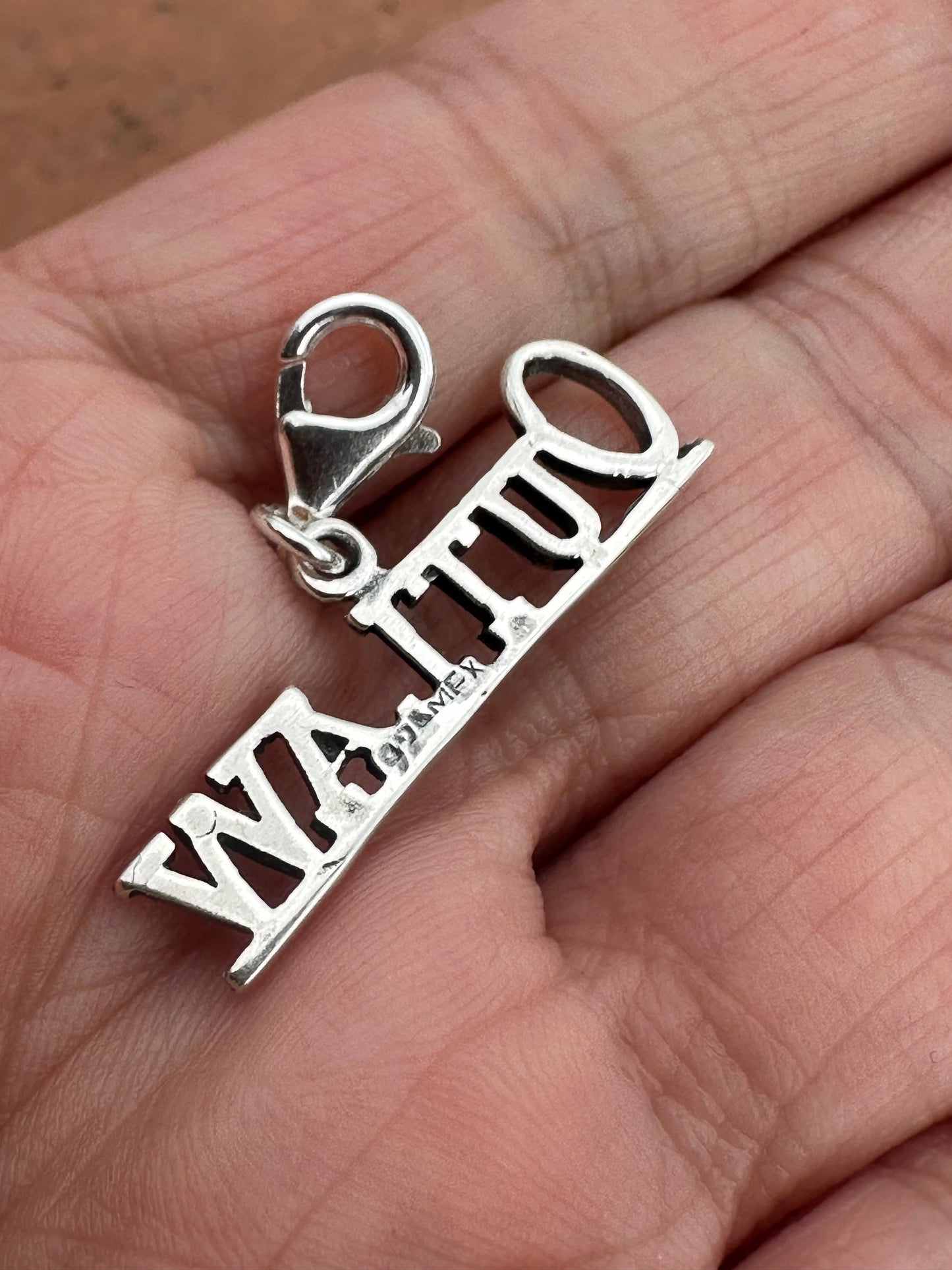 Handmade Sterling Silver “OUTLAW” Charm