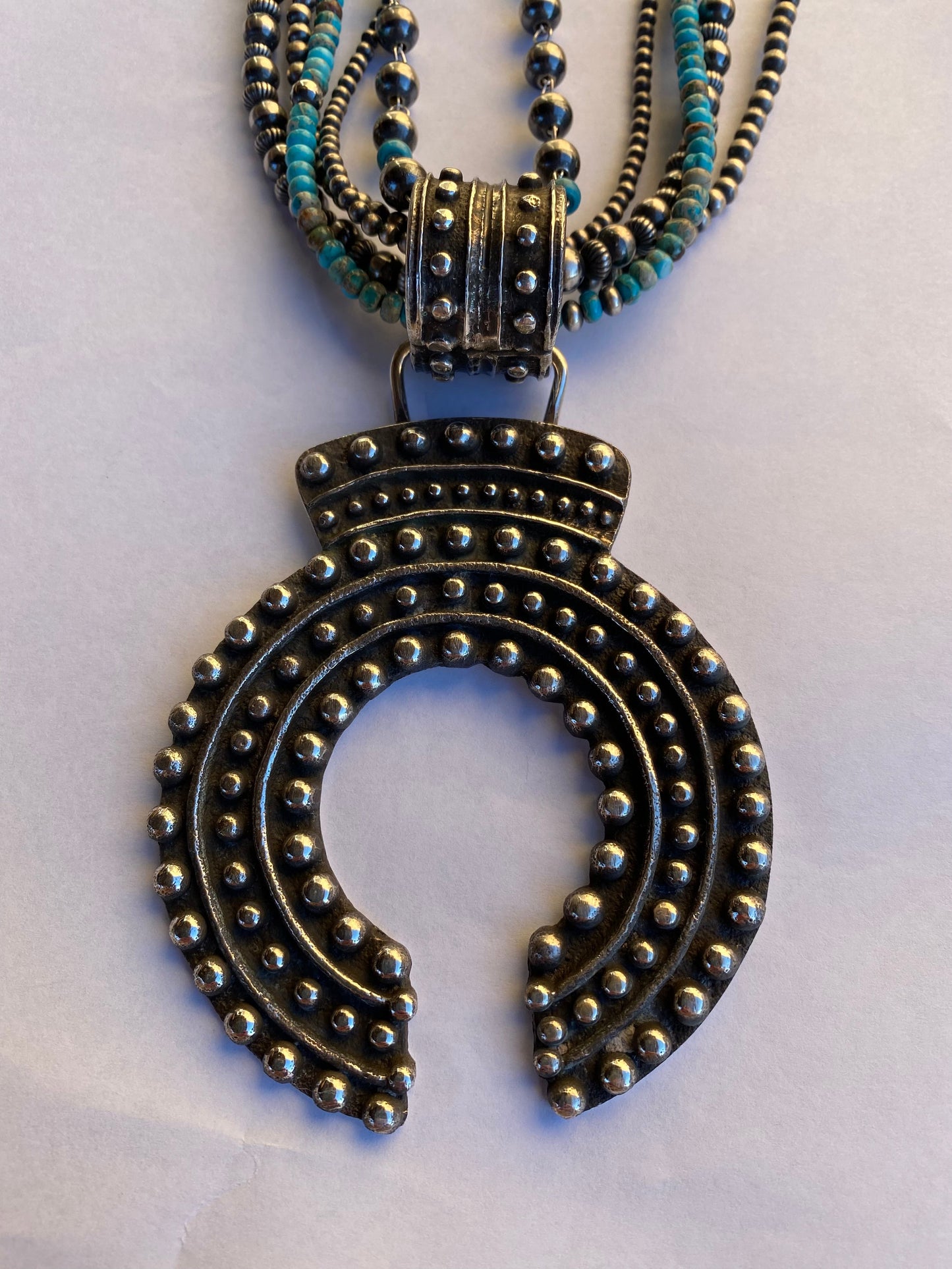 Handcrafted Sterling Silver Ball Cast Naja by Delbert Arviso