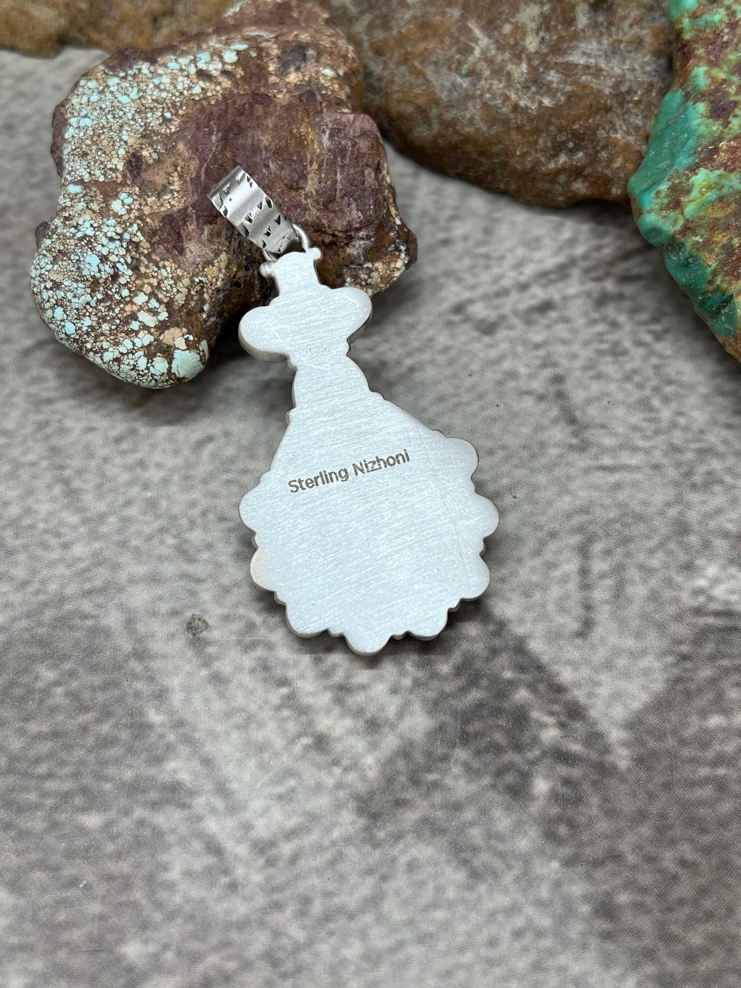 Handmade Sterling Silver White Buffalo Pendant with Signed Nizhoni