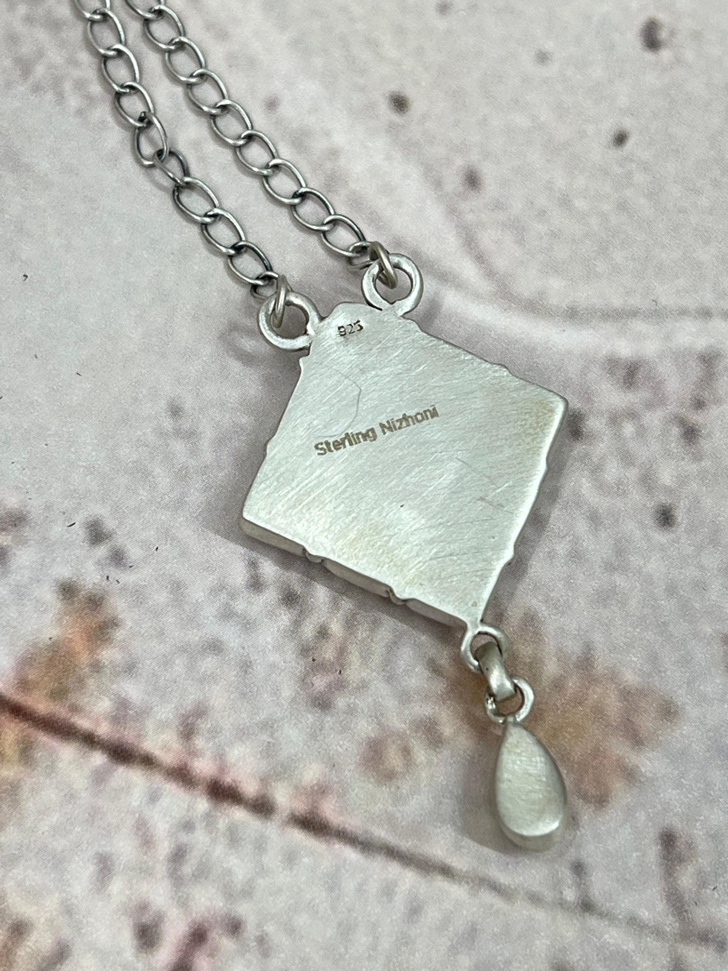 Handmade Sterling Silver White Buffalo Turquoise Necklace with Signed Nizhoni