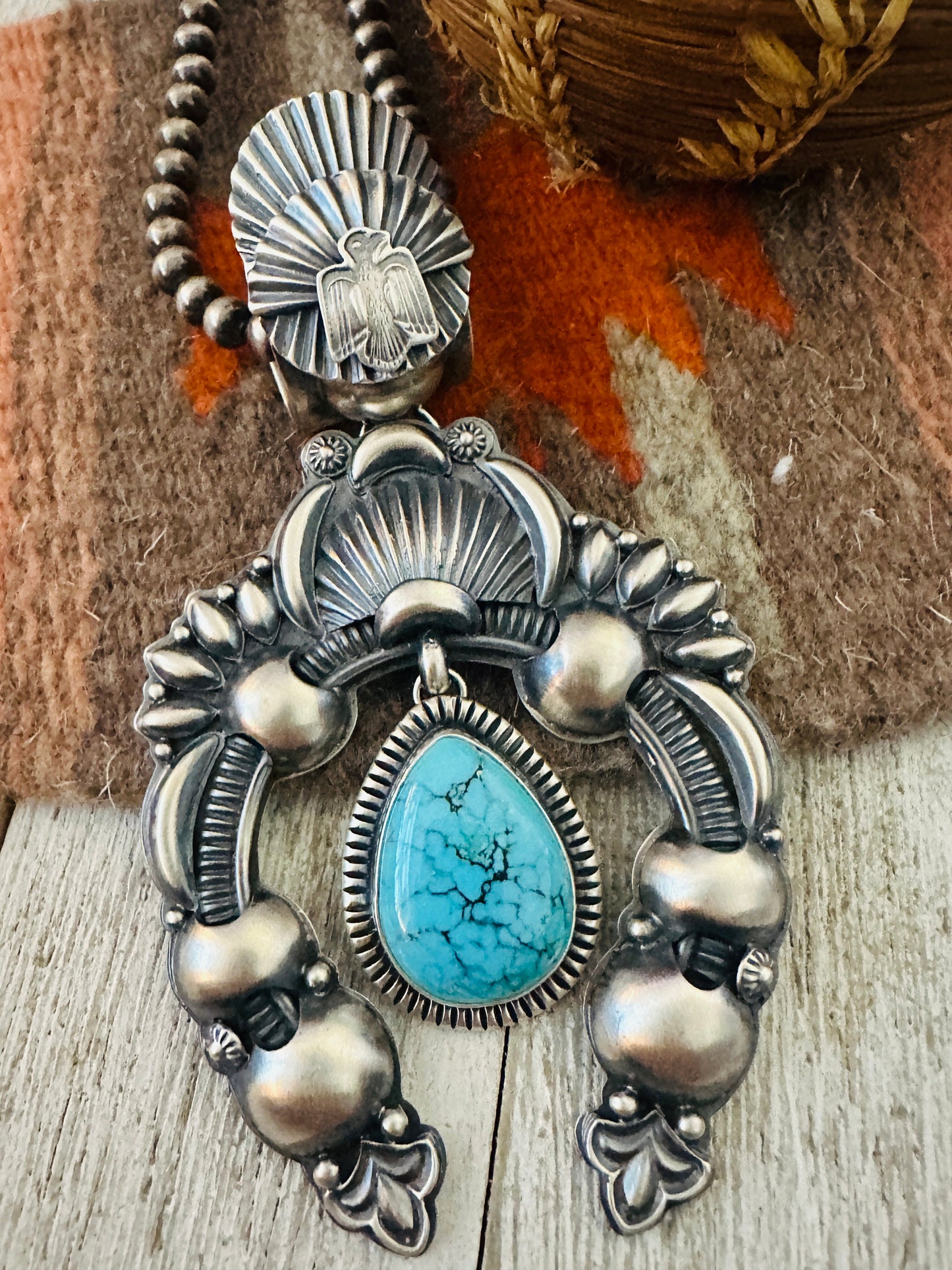 Handcrafted Sterling Silver & Turquoise Naja Pendant by Delbert Gordon