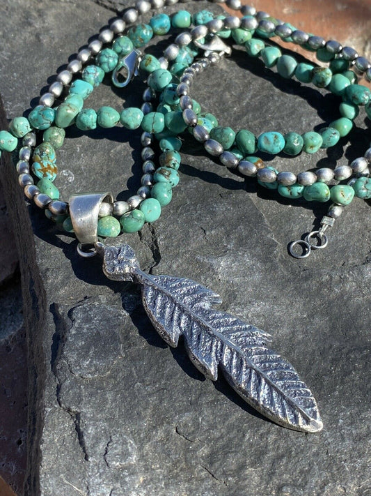 Handcrafted Sterling Silver Tufa Cast Feather