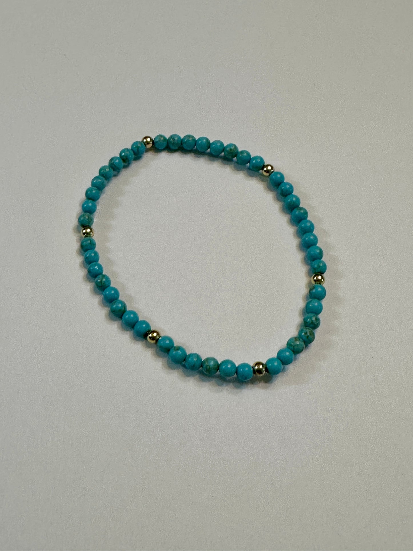Turquoise Stretch Bracelet With Gold Plated Beads