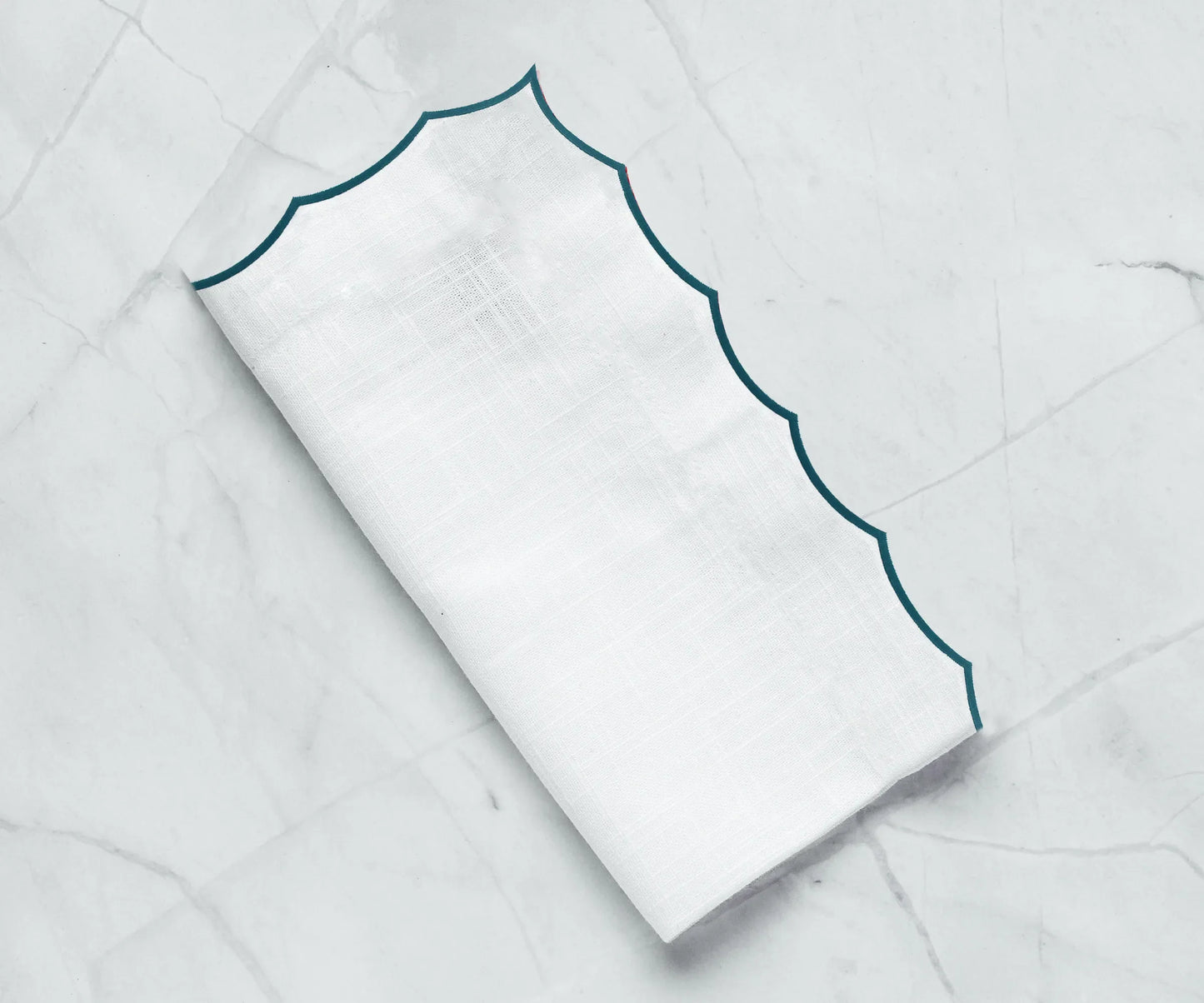 White scalloped napkins for weddings