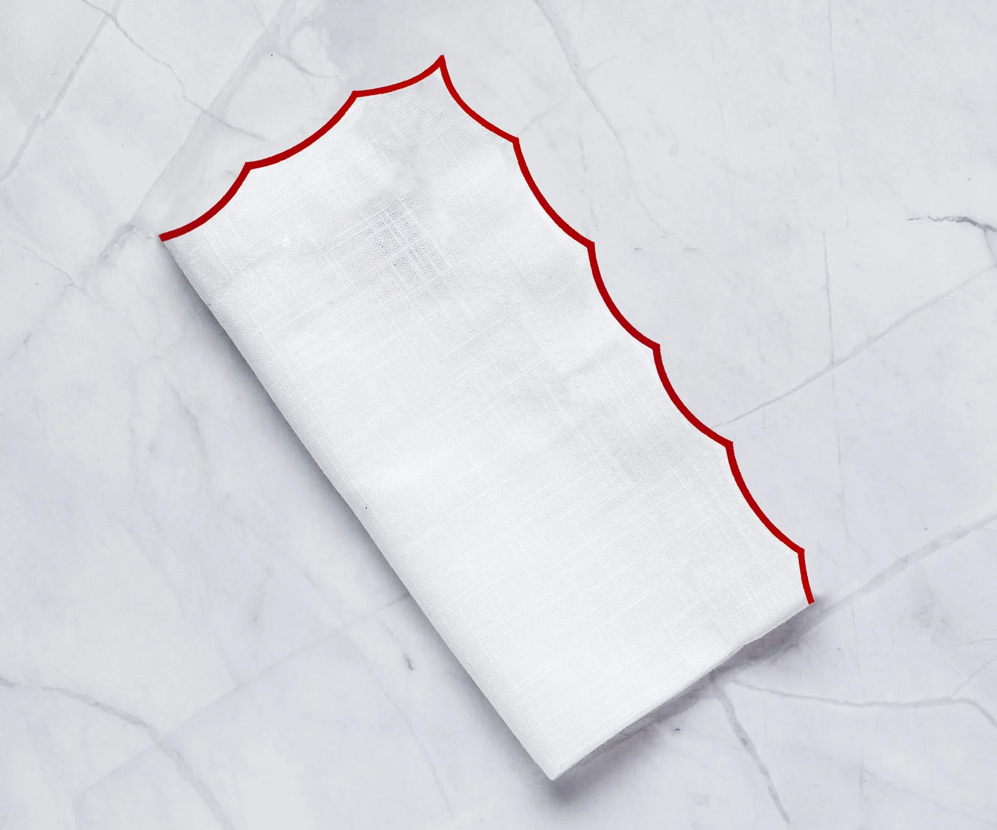 White scalloped napkins for weddings