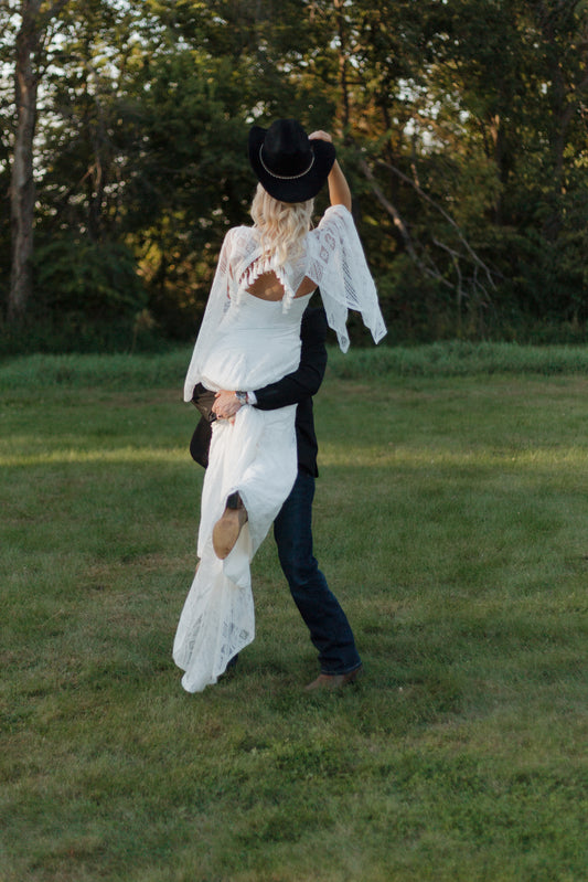 The Wilson Gown – Boho Lace Fit-and-Flare Wedding Dress with Fringe Back & Cape Sleeves