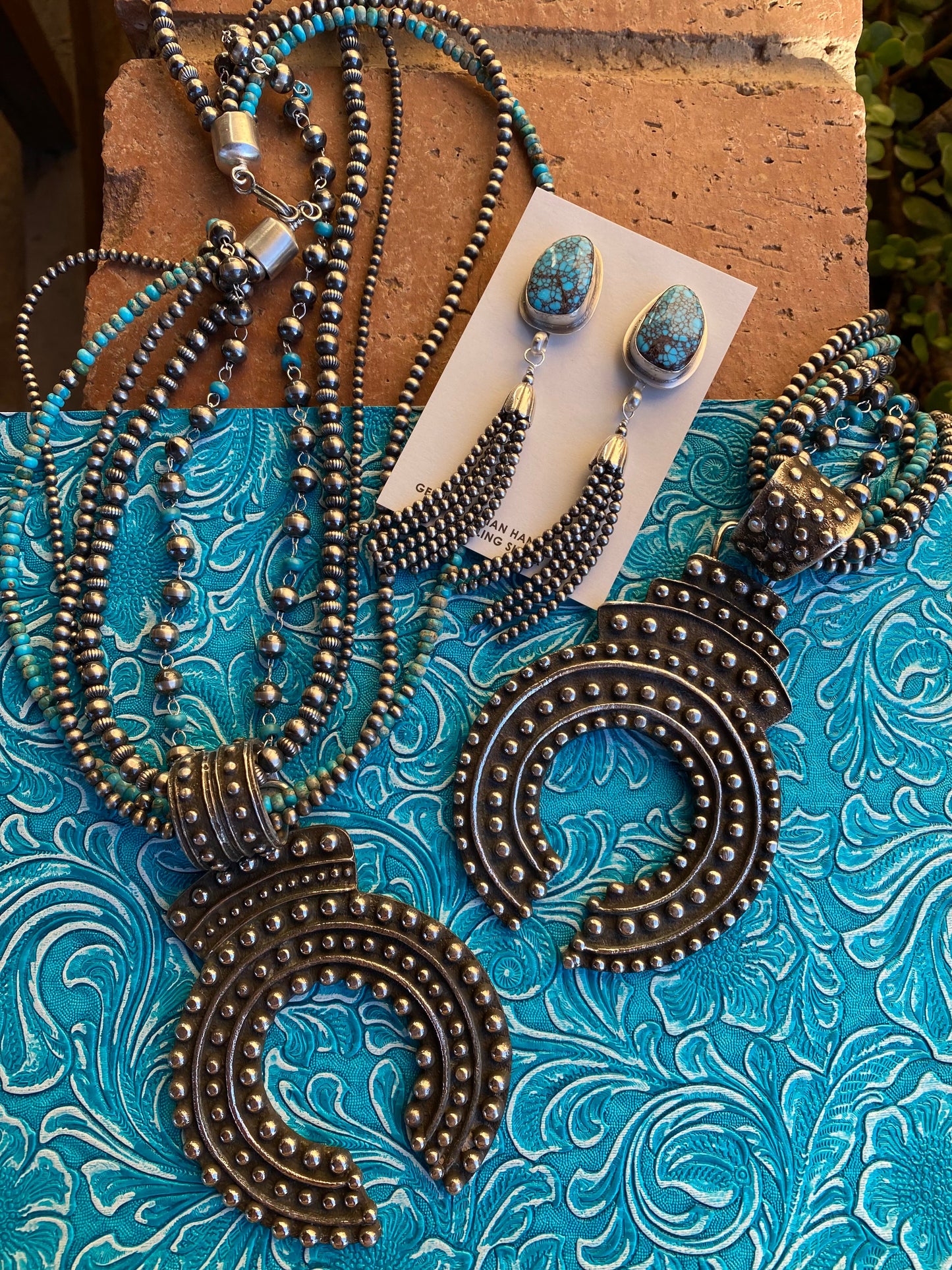 Handcrafted Sterling Silver Ball Cast Naja by Delbert Arviso