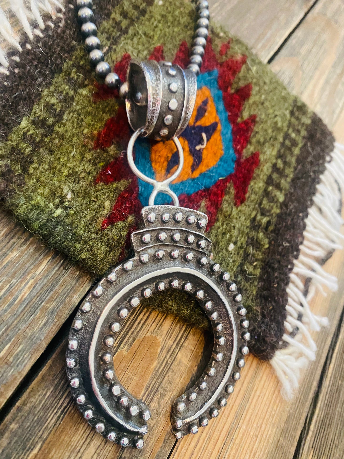 Handcrafted Sterling Silver Ball Cast Naja by Delbert Arviso