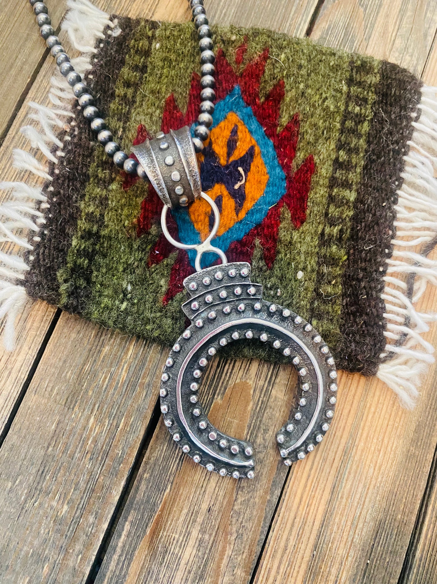 Handcrafted Sterling Silver Ball Cast Naja by Delbert Arviso