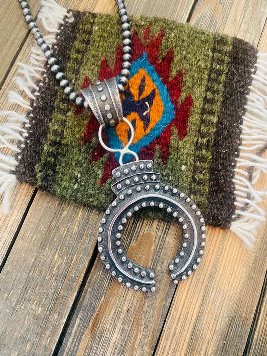Handcrafted Sterling Silver Ball Cast Naja by Delbert Arviso