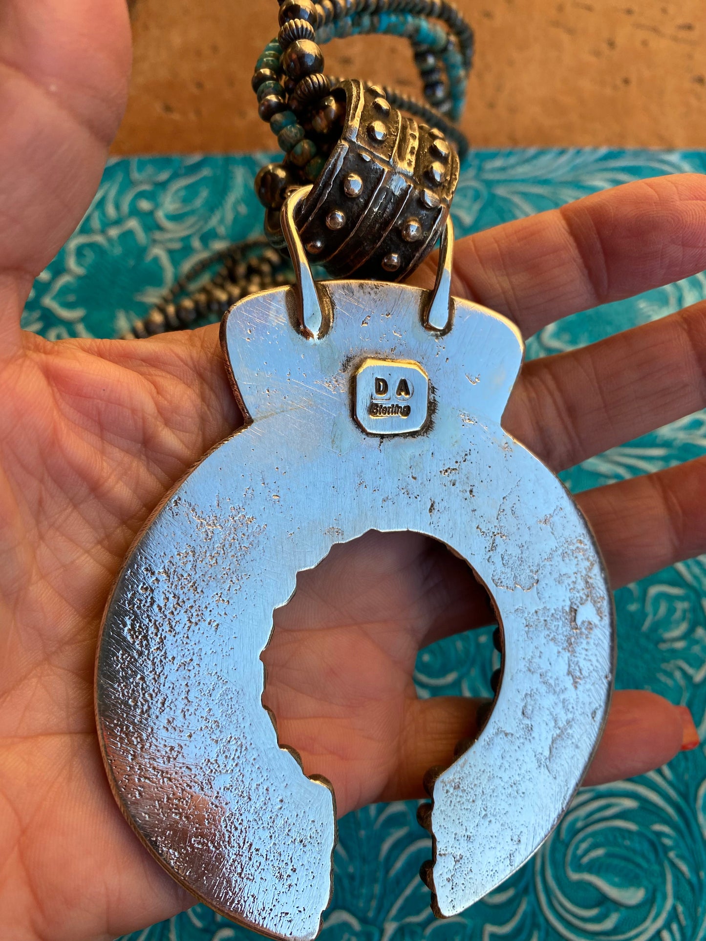 Handcrafted Sterling Silver Ball Cast Naja by Delbert Arviso