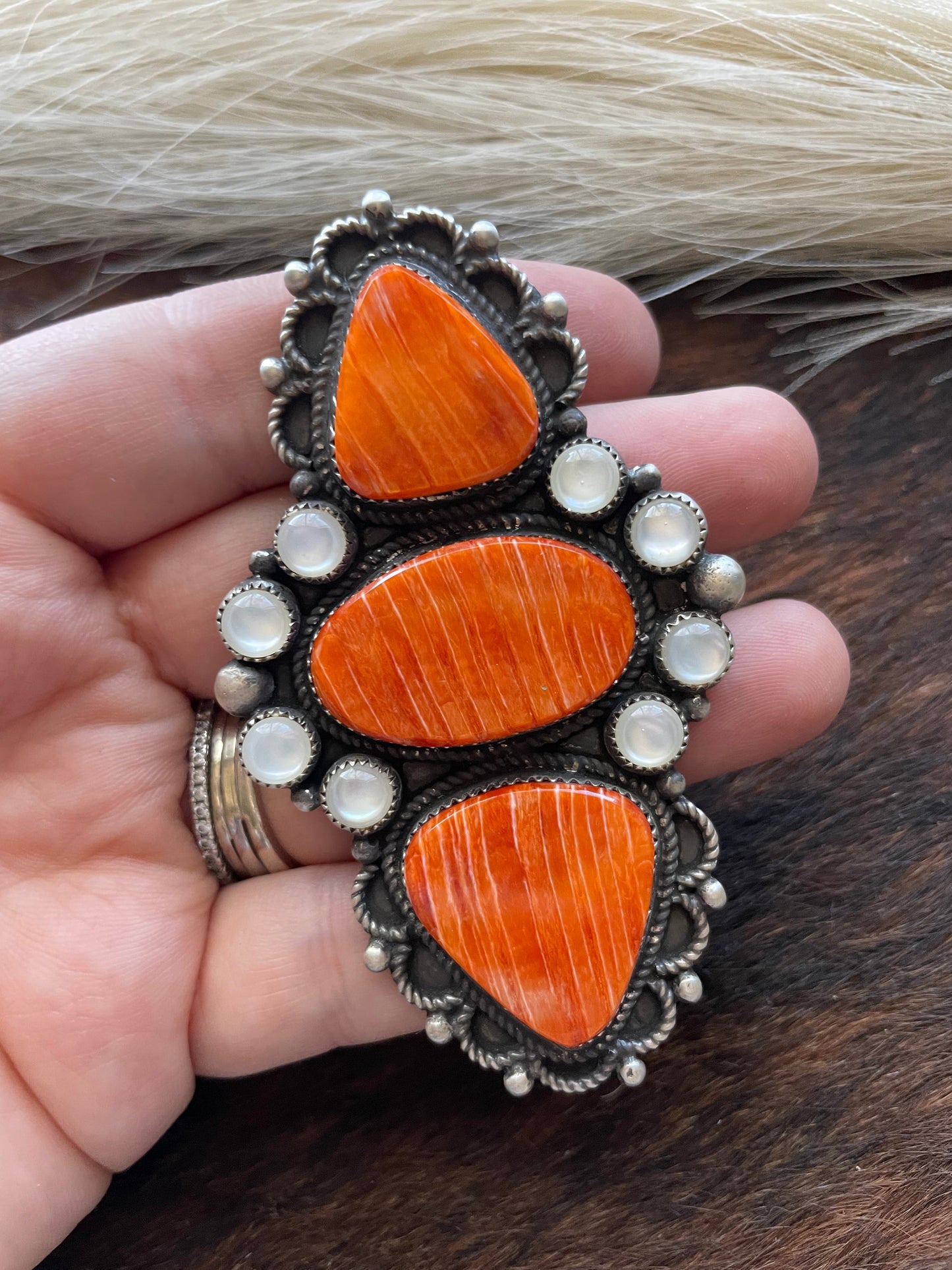 Devon Brown Handcrafted Sterling, Mother of Pearl Orange Spiny ring adjustable
