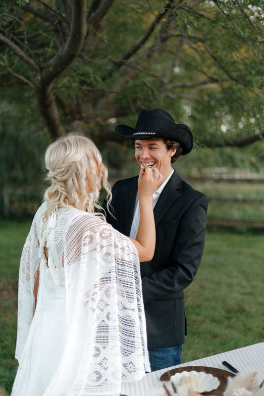 The Wilson Gown – Boho Lace Fit-and-Flare Wedding Dress with Fringe Back & Cape Sleeves